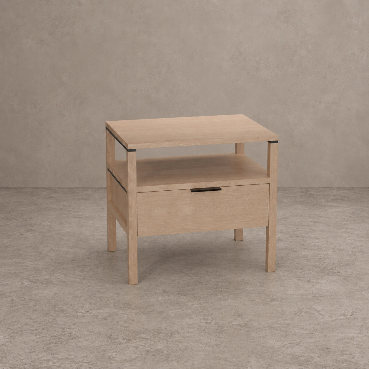 A light natural wood nightstand with a single drawer, open lower shelf, and open top surface, shown against a textured gray concrete-style background.