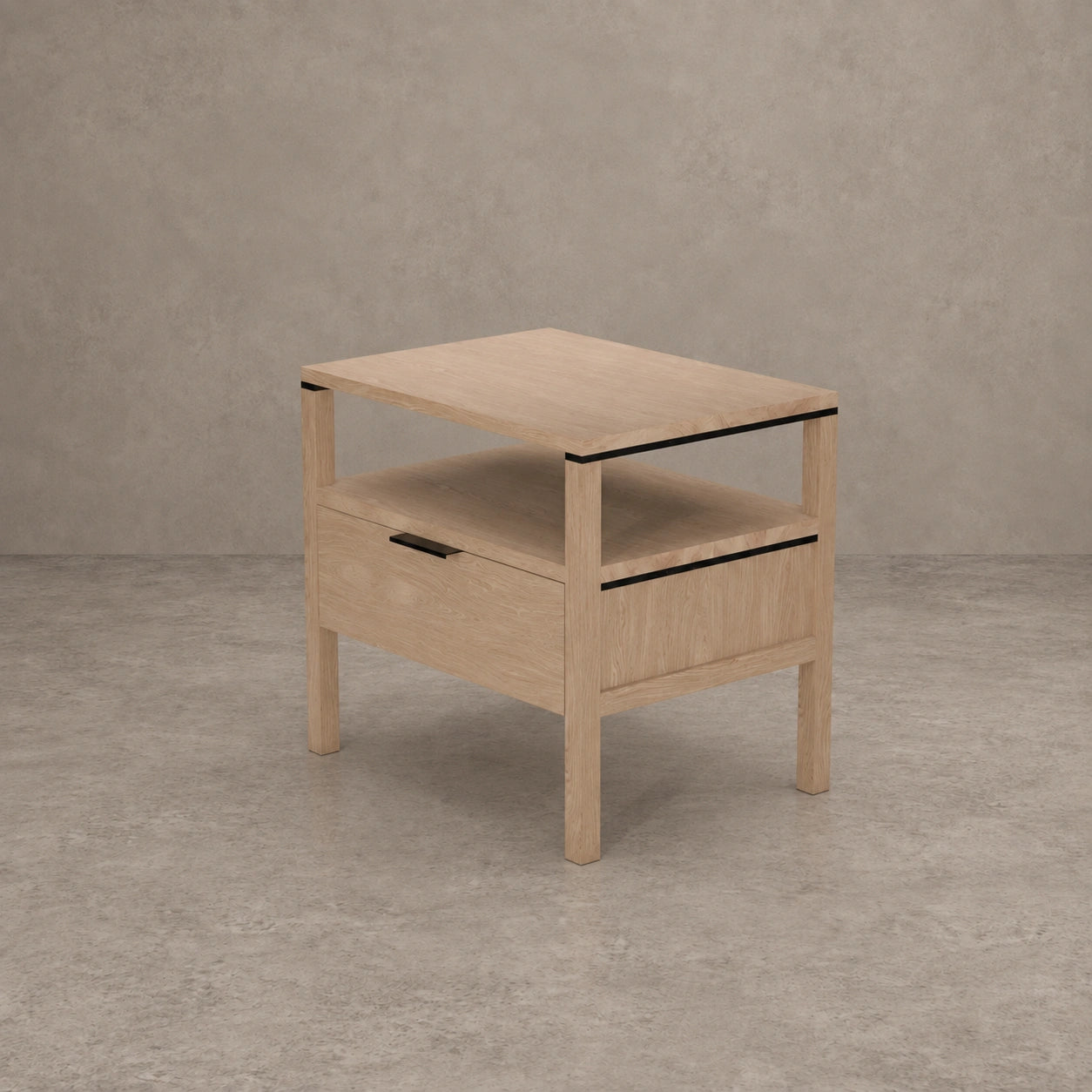A light oak wood side table with a single drawer, open shelf, and black metal accents, set against a textured gray concrete background.